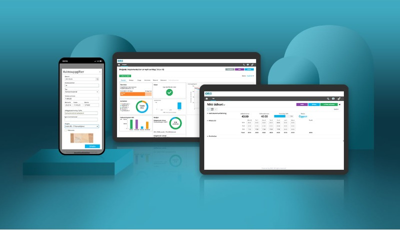 Datorer och mobil som visar Qbis Business System.